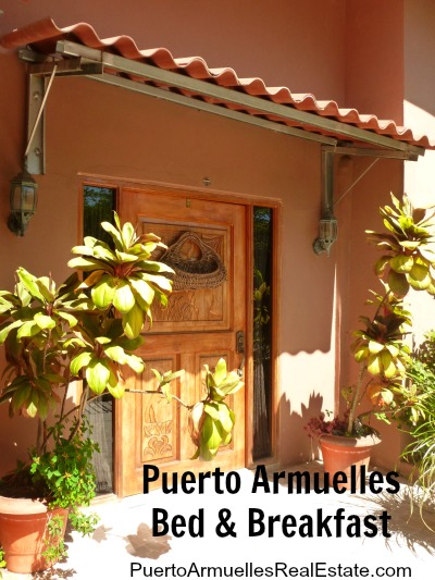 carved wooden front door and text